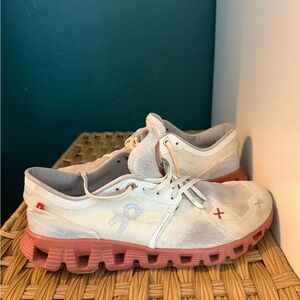 On Running White and Copper Athletic Shoes